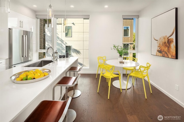 922 N 36th St, Seattle, WA 98103 - dining space with baseboards, wood finished floors, and recessed lighting