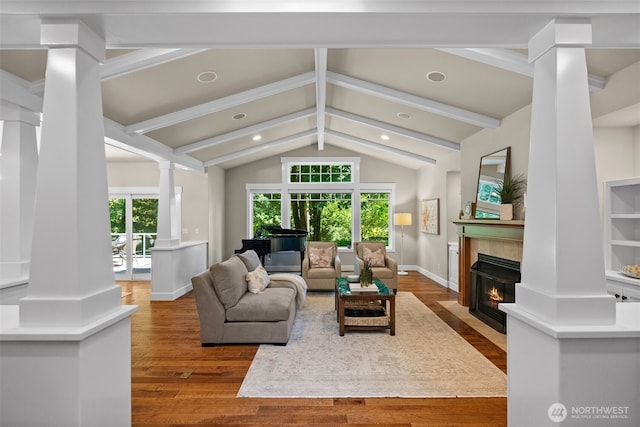 1808 153rd Street Ct NW, Gig Harbor, WA 98332 - living room featuring ornate columns, a fireplace with flush hearth, wood finished floors, and recessed lighting