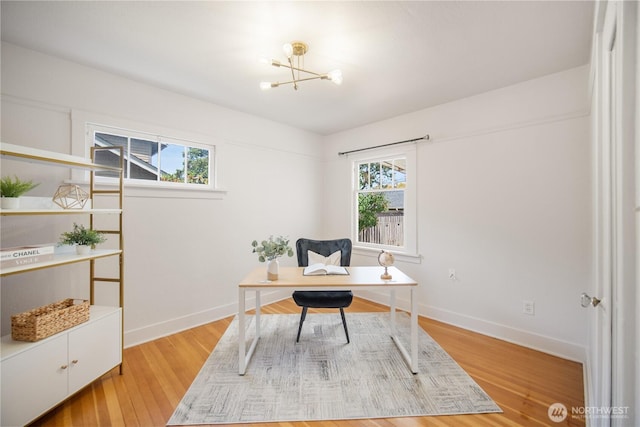 707 Ryan Ave, Sumner, WA 98390 - office space featuring plenty of natural light, a chandelier, and light wood-style floors