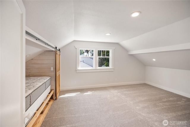 707 Ryan Ave, Sumner, WA 98390 - additional living space featuring light carpet, lofted ceiling, and recessed lighting