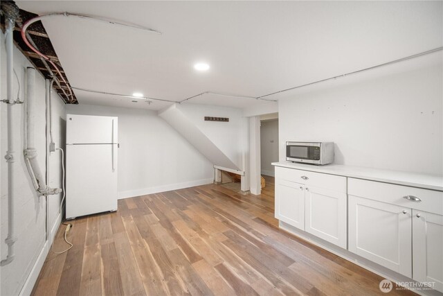 707 Ryan Ave, Sumner, WA 98390 - additional living space with light wood-type flooring and recessed lighting