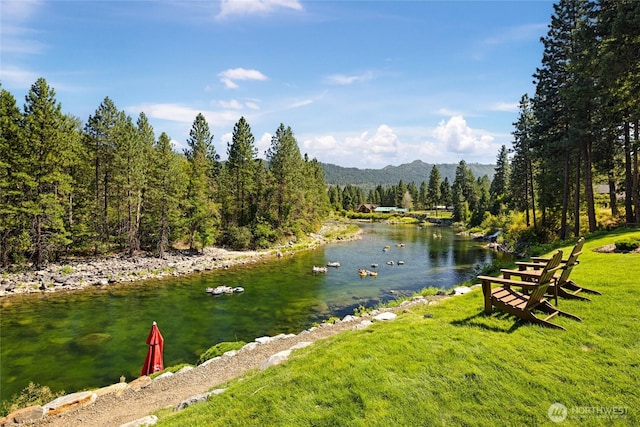 8775 Icicle Rd, Leavenworth, WA 98826 - water view featuring a mountainous background and a heavily wooded area