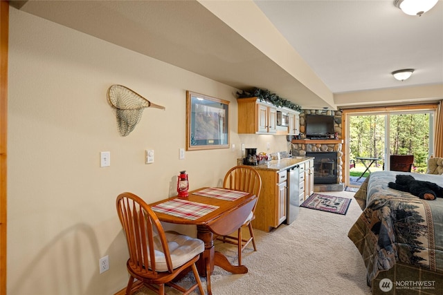 8775 Icicle Rd, Leavenworth, WA 98826 - dining area with light colored carpet and a stone fireplace