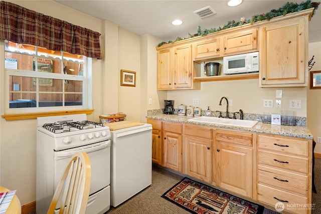 8775 Icicle Rd, Leavenworth, WA 98826 - kitchen with white appliances, a sink, light brown cabinetry, carpet, and recessed lighting
