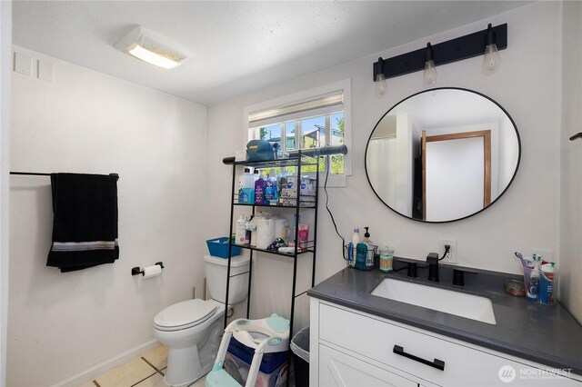 1958 12th Ave SE, Olympia, WA 98501 - bathroom featuring vanity, toilet, and tile patterned floors