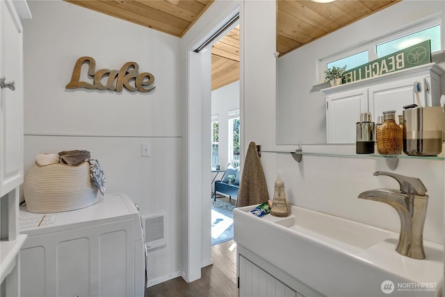 39424 Skipark Rd E, Eatonville, WA 98328 - bathroom featuring wooden ceiling, wood finished floors, and a sink