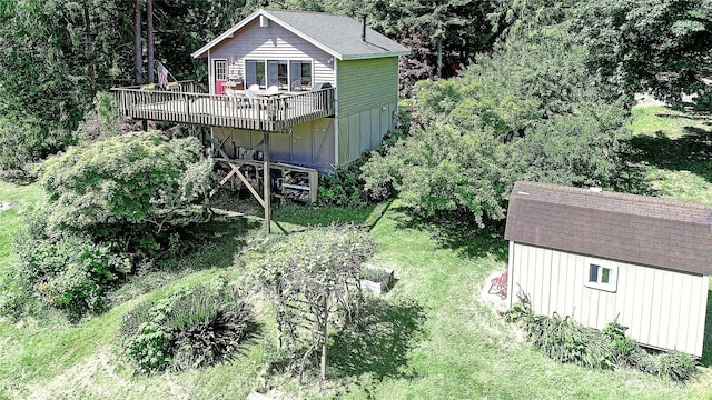 881 Lawson Rd, Camano Island, WA 98282 - rear view of property with a wooden deck, roof with shingles, and a lawn