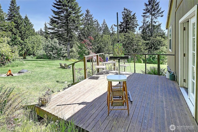 881 Lawson Rd, Camano Island, WA 98282 - wooden deck featuring a yard and view of wooded area