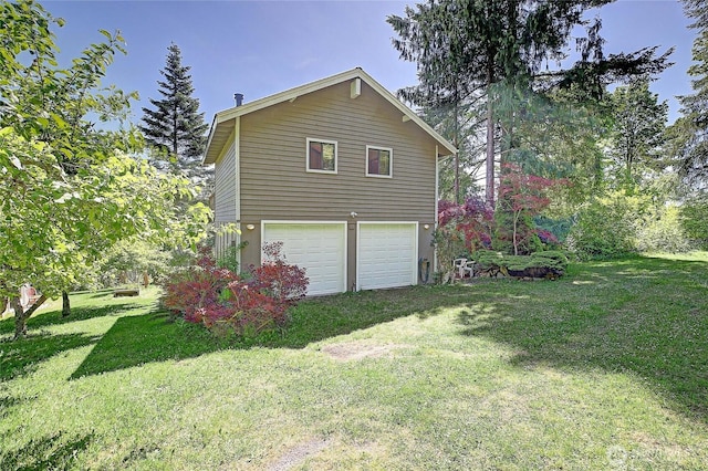 881 Lawson Rd, Camano Island, WA 98282 - view of side of property with an attached garage and a yard