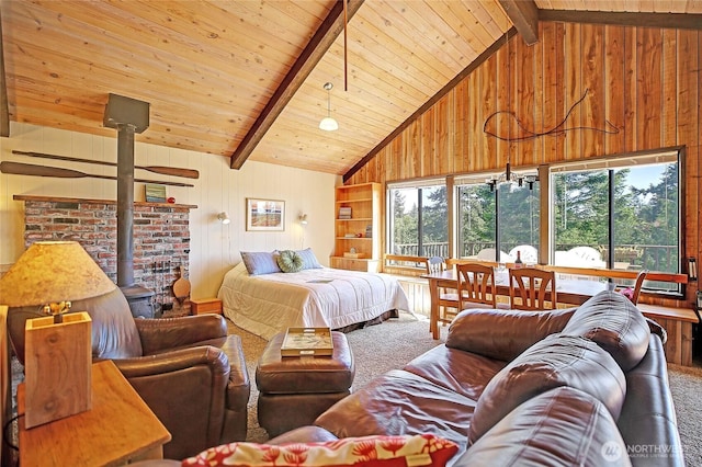 881 Lawson Rd, Camano Island, WA 98282 - bedroom with carpet flooring, a wood stove, wood walls, high vaulted ceiling, and wood ceiling with exposed beams