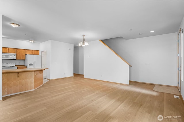 2546 Mitchell Ave Unit 2, Dupont, WA 98327 - unfurnished living room with light wood-style floors, a chandelier, and recessed lighting