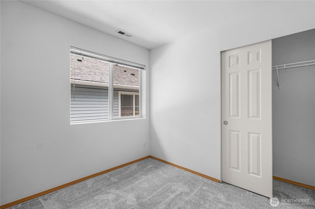 2546 Mitchell Ave Unit 2, Dupont, WA 98327 - unfurnished bedroom featuring a closet and carpet