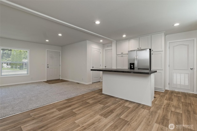 17101 Snowbell Ct SE, Yelm, WA 98597 - kitchen featuring stainless steel refrigerator with ice dispenser, white cabinets, recessed lighting, baseboards, and light wood-type flooring