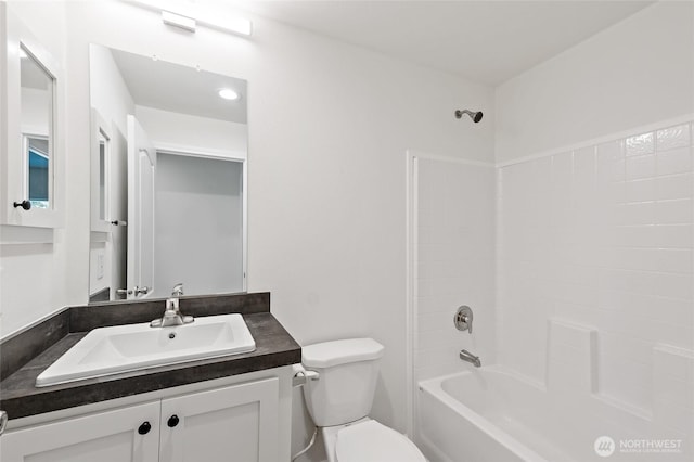 17101 Snowbell Ct SE, Yelm, WA 98597 - bathroom featuring toilet, vanity, and tub / shower combination