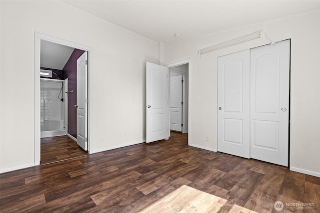 22106 Cedarview Dr E, Bonney Lake, WA 98391 - unfurnished bedroom featuring dark wood-type flooring, a closet, baseboards, and ensuite bath