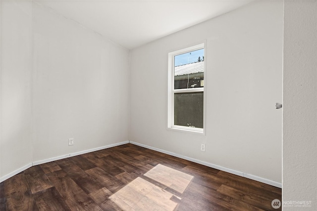 22106 Cedarview Dr E, Bonney Lake, WA 98391 - unfurnished room featuring dark wood-type flooring and baseboards