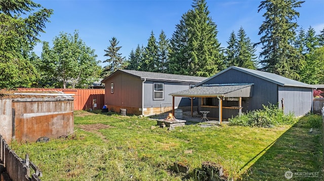 22106 Cedarview Dr E, Bonney Lake, WA 98391 - rear view of property featuring a fire pit