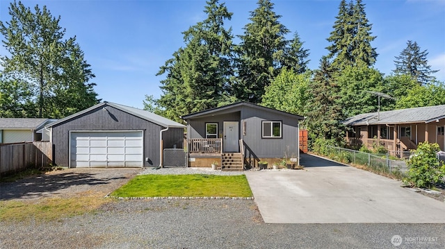 22106 Cedarview Dr E, Bonney Lake, WA 98391 - view of front of home featuring a garage, an outbuilding, and driveway