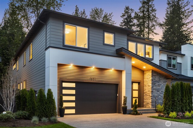 1201 222nd Ct SE, Sammamish, WA 98075 - modern home with an attached garage, stone siding, and concrete driveway