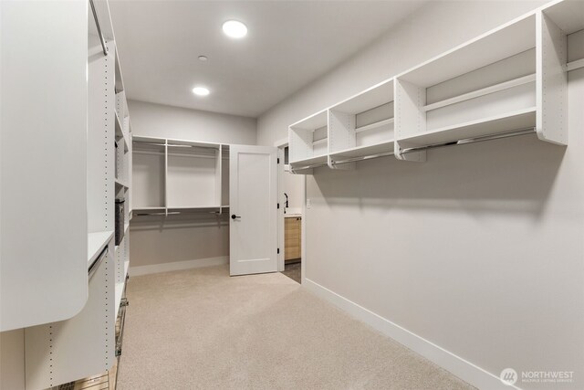 1201 222nd Ct SE, Sammamish, WA 98075 - walk in closet featuring carpet flooring