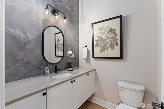 1201 222nd Ct SE, Sammamish, WA 98075 - bathroom with toilet, vanity, decorative backsplash, and baseboards
