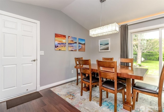 14918 Champion Estates Dr SE, Yelm, WA 98597 - dining space featuring dark wood finished floors and vaulted ceiling
