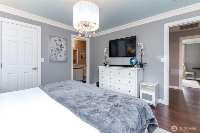 14918 Champion Estates Dr SE, Yelm, WA 98597 - bedroom featuring dark wood-style floors, ornamental molding, a chandelier, and ensuite bath
