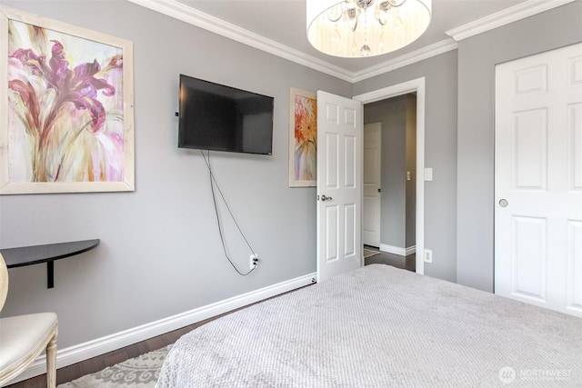 14918 Champion Estates Dr SE, Yelm, WA 98597 - bedroom featuring crown molding, a chandelier, and dark wood-style floors