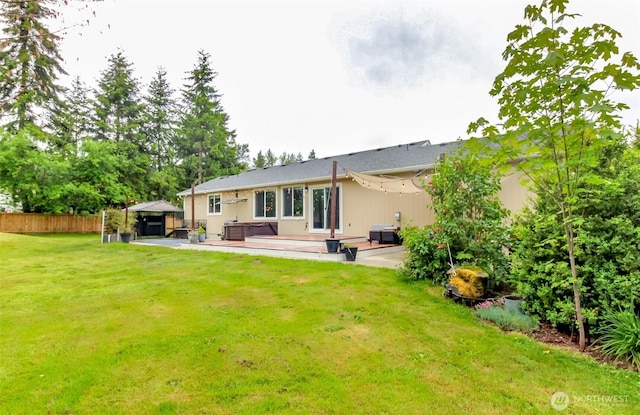 14918 Champion Estates Dr SE, Yelm, WA 98597 - back of house featuring a jacuzzi, a gazebo, a wooden deck, and a patio