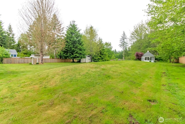 14918 Champion Estates Dr SE, Yelm, WA 98597 - view of yard featuring a storage unit and view of scattered trees