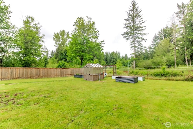 14918 Champion Estates Dr SE, Yelm, WA 98597 - fenced backyard with an outdoor structure