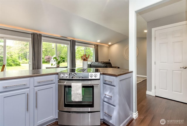 14918 Champion Estates Dr SE, Yelm, WA 98597 - kitchen with stainless steel electric range oven, dark wood-type flooring, and recessed lighting