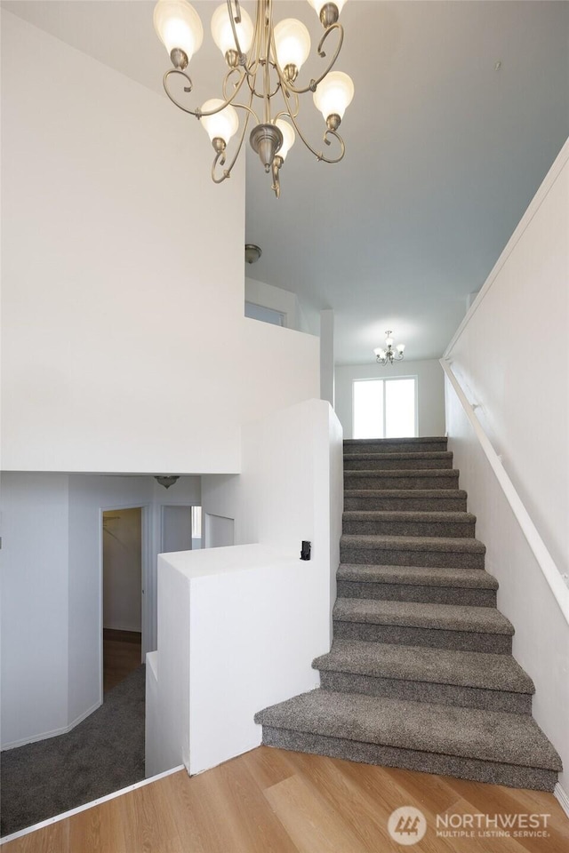 1105 200th Street Ct E, Spanaway, WA 98387 - stairway with a chandelier and wood finished floors