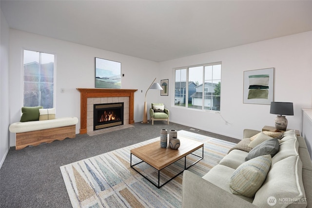 1105 200th Street Ct E, Spanaway, WA 98387 - living area featuring a tile fireplace, carpet flooring, and baseboards