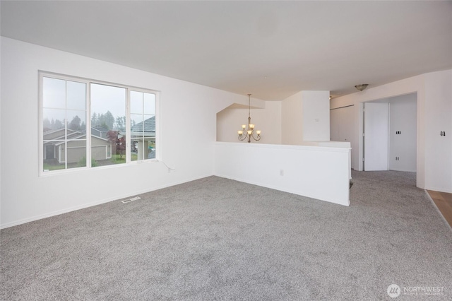 1105 200th Street Ct E, Spanaway, WA 98387 - carpeted empty room featuring a chandelier and baseboards