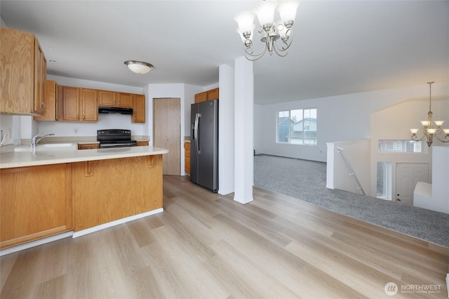 1105 200th Street Ct E, Spanaway, WA 98387 - kitchen with stainless steel refrigerator with ice dispenser, black electric range oven, a chandelier, light countertops, and open floor plan