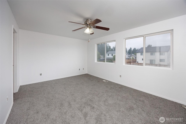 1105 200th Street Ct E, Spanaway, WA 98387 - spare room featuring carpet, a ceiling fan, and baseboards