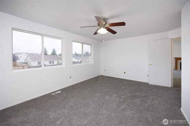 1105 200th Street Ct E, Spanaway, WA 98387 - empty room with a ceiling fan and dark colored carpet