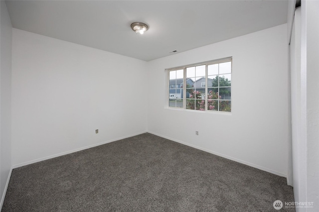 1105 200th Street Ct E, Spanaway, WA 98387 - unfurnished room featuring dark carpet and baseboards