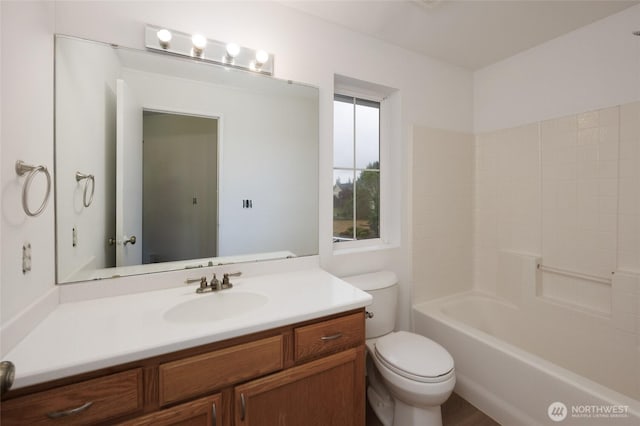 1105 200th Street Ct E, Spanaway, WA 98387 - bathroom featuring toilet, vanity, and tub / shower combination