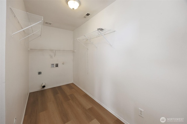 1105 200th Street Ct E, Spanaway, WA 98387 - laundry room featuring hookup for a washing machine, wood finished floors, hookup for an electric dryer, and baseboards