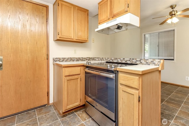 7620 194th Ave E, Bonney Lake, WA 98391 - kitchen featuring stainless steel range with electric cooktop, under cabinet range hood, backsplash, ceiling fan, and a peninsula