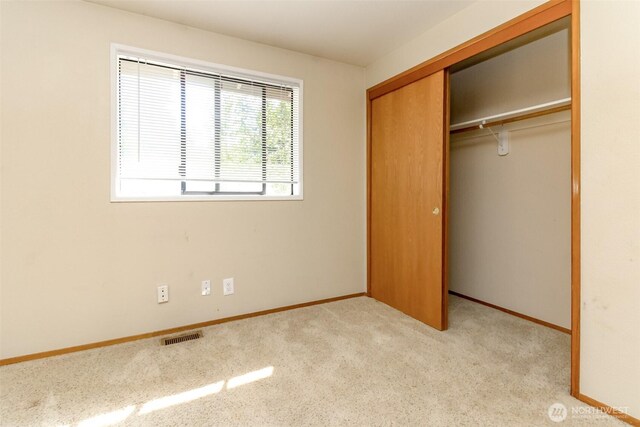 7620 194th Ave E, Bonney Lake, WA 98391 - unfurnished bedroom featuring carpet flooring and a closet