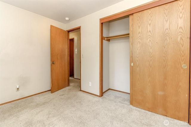 7620 194th Ave E, Bonney Lake, WA 98391 - unfurnished bedroom featuring light colored carpet and a closet