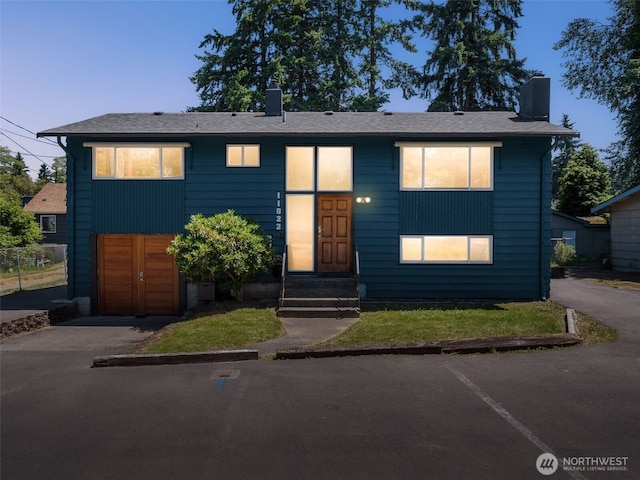 11822 10th Ave S, Seattle, WA 98168 - view of front of property featuring entry steps and a chimney