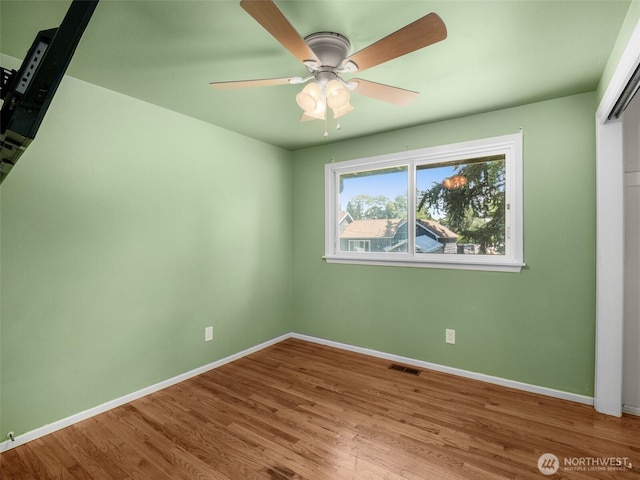 11822 10th Ave S, Seattle, WA 98168 - empty room with wood finished floors and a ceiling fan