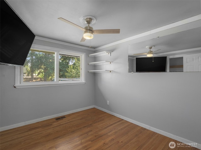 11822 10th Ave S, Seattle, WA 98168 - empty room featuring a ceiling fan and wood finished floors