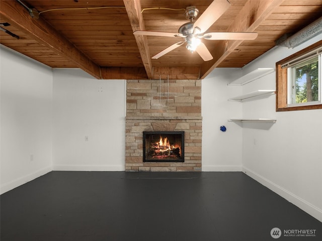 11822 10th Ave S, Seattle, WA 98168 - unfurnished living room featuring a wooden ceiling with exposed beams, a stone fireplace, and a ceiling fan