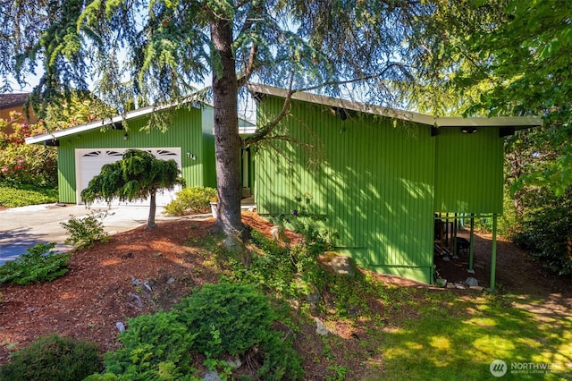 714 SW 296th St, Federal Way, WA 98023 - view of property exterior featuring concrete driveway and an attached garage