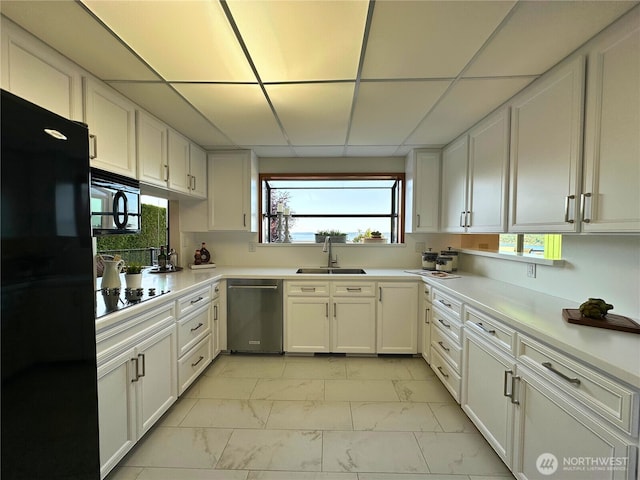714 SW 296th St, Federal Way, WA 98023 - kitchen featuring black appliances, a sink, light marble finish flooring, white cabinets, and light countertops